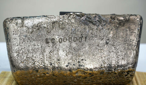 Closeup of silver bar with “LC 000001” stamped on it.