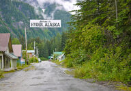 The welcome sign hanging above the only street entering Hyder, Alaska.