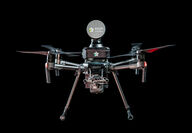 Closeup of an Exyn drone equipped with lidar survey equipment.