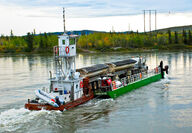 Minto copper mine concentrates barged across Yukon River to Skagway Ore Terminal