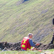 Exploration crew examining a mineralized outcropping at Mt. Hinton project.
