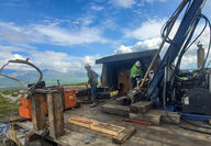 Two drillers test a nickel deposit on a warm late summer day in Alaska.