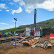 A drill tests for copper, gold, and silver on a summer day in Alaska.