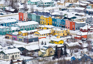 Brightly colored buildings in winter at Dawson City.