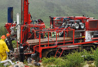 Drill crew operating a bright red rig at BMC’s Kudz Ze Kayah project.