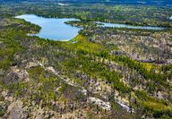 An exposed outcrop surrounded by lakes in NWT, Canada.