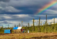Rainbow shines down over Banyan Gold camp in Yukon.