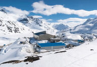 The Brucejack mill and camp facilities are nestled in snow-covered mountains.