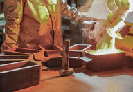 Molten gold pours into a bar mold at the Fort Knox mine.