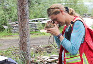 Banyan Gold President and CEO Tara Christie inspecting core.