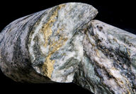 Closeup of thick gold veins running through quartz in drill core from Brucejack.