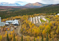 A headframe from historic exploration rises above a fall landscape at Bornite.