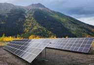 A new solar array in front of hill with golden fall foliage in BC.