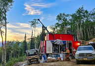 A drill tests for gold during a near midnight sunset north of Fairbanks, Alaska.