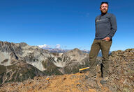 HighGold CEO and geologist Darwin Green on an Alaska mountain ridge.