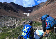 Two Snowline Gold geologists surveying Rogue property in Yukon.