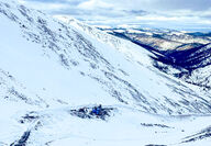 Drill pad constructed on a snowy slope at RC Gold in Yukon.